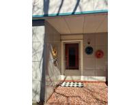 Inviting front door with unique sunflower décor and tiled landing, creating a charming entrance at 109 Stephens St, Chapel Hill, NC 27516