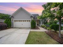 Charming home featuring a two-car garage, and beautifully landscaped front yard at 219 Rosedale Creek Dr, Durham, NC 27703