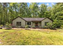 Charming single-story home with manicured lawn, landscaped flower beds, and inviting front entrance at 237 Jason Way, Youngsville, NC 27596