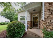 Charming front entrance with stone accents and well-maintained landscaping at 306 Plank Bridge Way, Morrisville, NC 27560