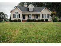 Charming single-Gathering home showcasing a well-maintained lawn and inviting front porch at 780 Pondview Ct, Rocky Mount, NC 27804