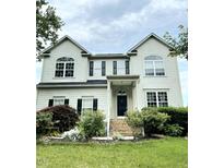 Traditional two-story home with symmetrical design, dormers, and a well-manicured front lawn at 1039 Bellenden Dr, Durham, NC 27713