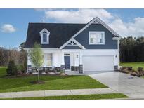 Charming two-story home with blue and white siding, a well-manicured lawn, and an attached two car garage at 135 Harmony Ranch Lane, Franklinton, NC 27525