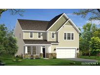 Charming two-story home featuring stone accents, a covered porch, and an attached two-car garage at 173 Copperleaf Court, Franklinton, NC 27525