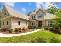 Charming two-story home with stone accents and manicured landscaping at 4306 Infinity Ln, Durham, NC 27705
