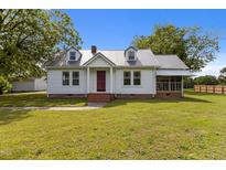 Charming one story home with landscaped front yard and metal roof at 2227 Us-15, Creedmoor, NC 27522