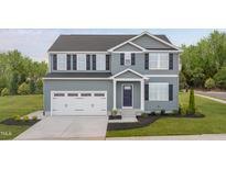 Charming two-story home boasts a two-car garage, manicured lawn, and inviting front entrance at 314 N Coral Bells Way, Four Oaks, NC 27524
