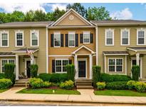 Charming townhome with manicured landscaping and inviting front entrance at 361 Anterbury Dr # B, Apex, NC 27502