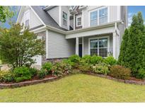 Charming two-story home with landscaped front yard and inviting entrance at 3904 Freemark Ln, Fuquay Varina, NC 27526