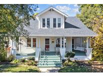 Charming two-story home featuring a welcoming front porch and landscaped front yard at 504 Hillcrest Ave, Burlington, NC 27215