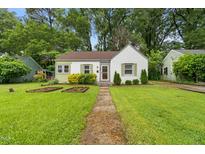 Charming home with a well-manicured lawn and inviting front yard landscaping at 109 Davidson Ave, Durham, NC 27704