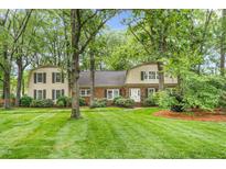 Charming home featuring a brick facade, manicured lawn and mature trees at 3123 Amherst Ave, Burlington, NC 27215