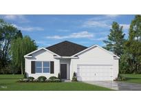 Charming one-story home featuring a two-car garage, manicured lawn, and classic white siding at 7407 Michelle Rd, Rocky Mount, NC 27803