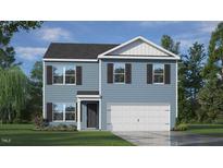 Charming two-story home featuring a classic design and inviting curb appeal with a well manicured lawn at 7416 Michelle Rd, Rocky Mount, NC 27803