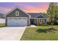 Charming single-Gathering home boasting a well-manicured lawn and an inviting front entrance at 8615 Kenridge Ln, Fuquay Varina, NC 27526