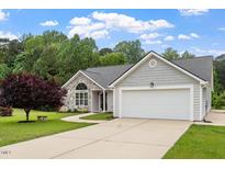 Charming single Gathering home with stone accents and two-car garage at 1969 Bowles Ave, Creedmoor, NC 27522