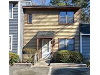 Two-story home featuring a wooden facade, a ramp leading to the front door, and mature landscaping at 2146 Charles St # 12, Durham, NC 27707