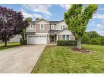 Charming two-story home featuring a well-maintained lawn, attached two-car garage, and beautiful stone accents at 412 Collington Dr, Mebane, NC 27302