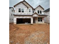 New two-story home with a two-car garage awaiting exterior finishing at 452 Golden Dragonfly St, Wake Forest, NC 27587