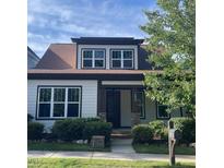 Charming home with a manicured lawn, complemented by mature landscaping and a welcoming facade at 1930 Briar Chapel Pkwy, Chapel Hill, NC 27516