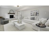 Cozy living room features a fireplace, soft textures, and stylish decor at 4307 Pope Rd, Durham, NC 27707