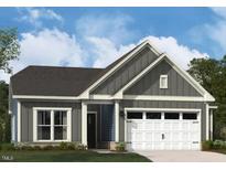 Charming gray home featuring a two-car garage, inviting front porch, and professionally landscaped front yard at 1105 Masters Place Way # 154, Durham, NC 27703