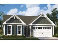 Charming home with a welcoming exterior, complete with a two-car garage and dark-colored shutters at 2000 Kapalua Way # 187, Durham, NC 27703