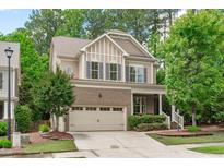 Charming two-story home with brick accents, a well-manicured lawn, and a two-car garage at 3304 Rockland Ridge Dr, Cary, NC 27519