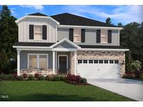 Charming two-story home featuring a brick veneer, gray siding, black shutters, and a well-manicured lawn at 1104 Landen Creek Ln, Zebulon, NC 27597