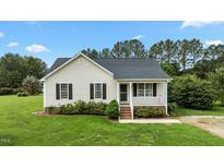 Charming single-story home with a cozy front porch and well-manicured lawn at 3803 Ridgewood Dr, Franklinton, NC 27525