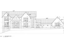 Stately two-story home with a symmetrical design, stone accents, and a prominent gabled roof at 498 Brook Green Ln # 25, Pittsboro, NC 27312