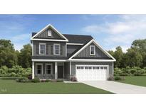 Beautiful new construction home with gray siding, stone accents, and an attached two-car garage at 75 Venture Ct, Franklinton, NC 27525