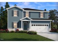 Charming two-story home with blue siding, white trim, an attached garage, and well-maintained landscaping at 1105 Landen Creek Ln, Zebulon, NC 27597