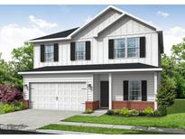 Charming two-story home featuring a two-car garage, brick accents, and classic board and batten siding at 112 Hays St, Oxford, NC 27565