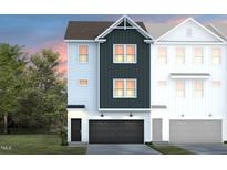 Charming two-story townhome featuring a black garage door, white siding, and black shutters at 2152 Grouse Ski Cir, Apex, NC 27523