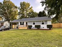 Charming single-story home featuring a welcoming front porch and well-maintained lawn at 2200 Wyman Pl, Durham, NC 27707