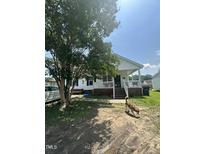 Charming single-Gathering home featuring a classic front porch and a spacious yard at 333 Park Ave, Rocky Mount, NC 27801