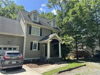 Charming two-story home with a traditional design, dormer windows, and a covered front porch at 110 Ruth St, Carrboro, NC 27510