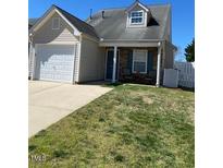 Charming home featuring a front yard, a garage, and a cozy front porch area at 11017 Peacock Moss St, Raleigh, NC 27613
