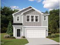 Charming two-story home with gray siding, white trim, black door, and two-car garage at 1172 Solace Way, Rolesville, NC 27571