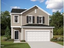 Inviting two-story home with a neutral color scheme, black shutters, and a two car garage at 1201 Solace Way, Rolesville, NC 27571