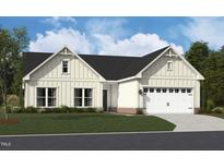 Charming single-Gathering home featuring a two-car garage, a manicured lawn, and stylish modern farmhouse architecture at 1205 Masters Place Way # 183, Durham, NC 27703