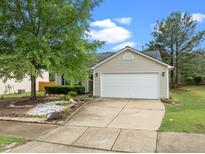 Charming home with a two-car garage, inviting curb appeal, and beautiful landscaping at 1728 E Honey Springs Ave, Fuquay Varina, NC 27526