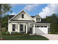 Charming single-Gathering home featuring stone accents, a two-car garage, and a beautifully landscaped front yard at 2006 Kapalua Way # 190, Durham, NC 27703