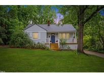 Charming single-story home with a well-manicured lawn and inviting front porch at 2324 Stevens Rd, Raleigh, NC 27610