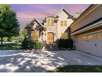 Charming home featuring a stone facade, manicured landscaping, and an inviting entrance at 268 The Preserve Trl, Chapel Hill, NC 27517