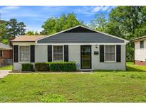 Charming single-story home with a well-maintained lawn and tidy front shrubbery at 2704 Atlantic St, Durham, NC 27707