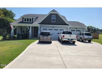 Charming home with a manicured lawn and a spacious driveway, offering ample parking at 834 Mamie Upchurch Rd, Lillington, NC 27546