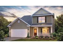 Charming two-story home with a covered front porch and attached two-car garage at 1249 Turkey Trot Rd, Wendell, NC 27591