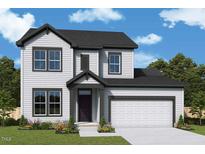 Charming two-story home with white siding, a black roof, and an attached two-car garage at 13 Cozy Hvn, Fuquay Varina, NC 27526